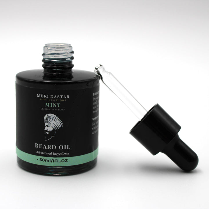 Beard oil bottle with dropper on a white background