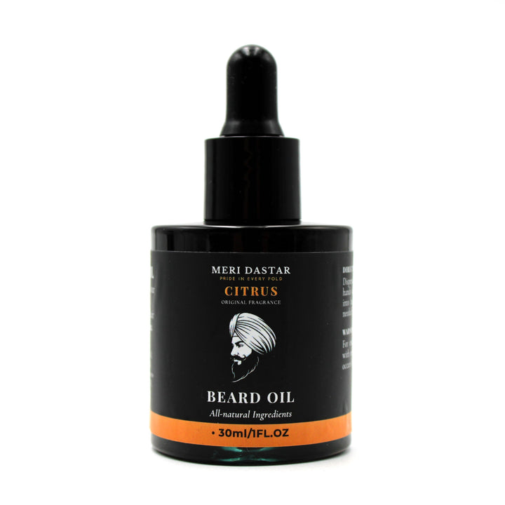 Beard oil bottle with black label on a white background