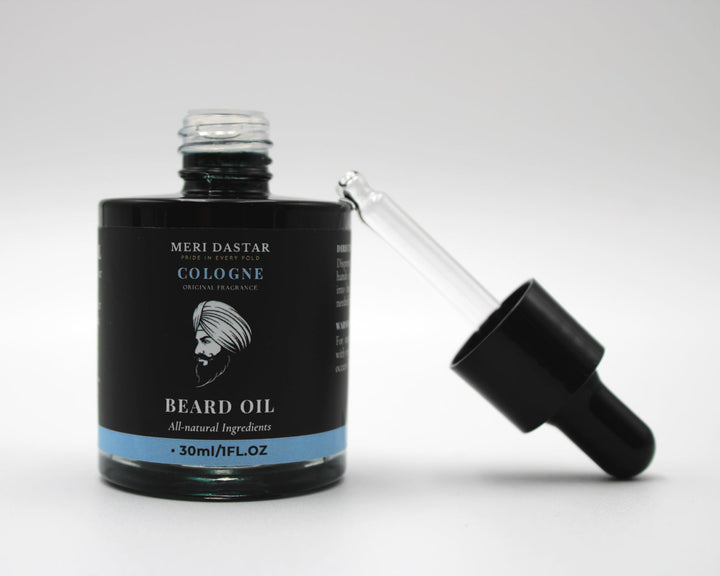 Beard oil bottle with dropper on a white background