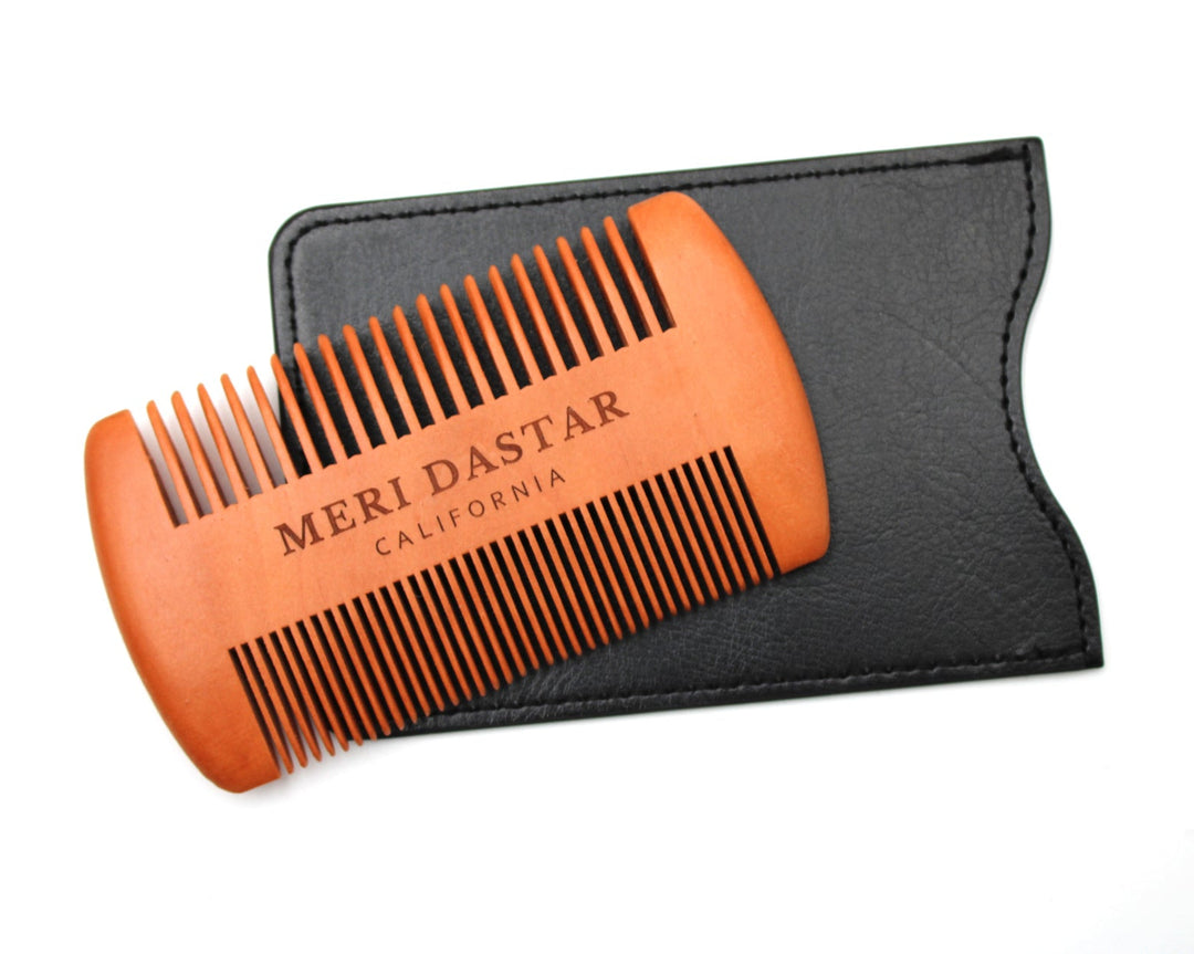 Orange Meri Dastar comb with black case on a white background