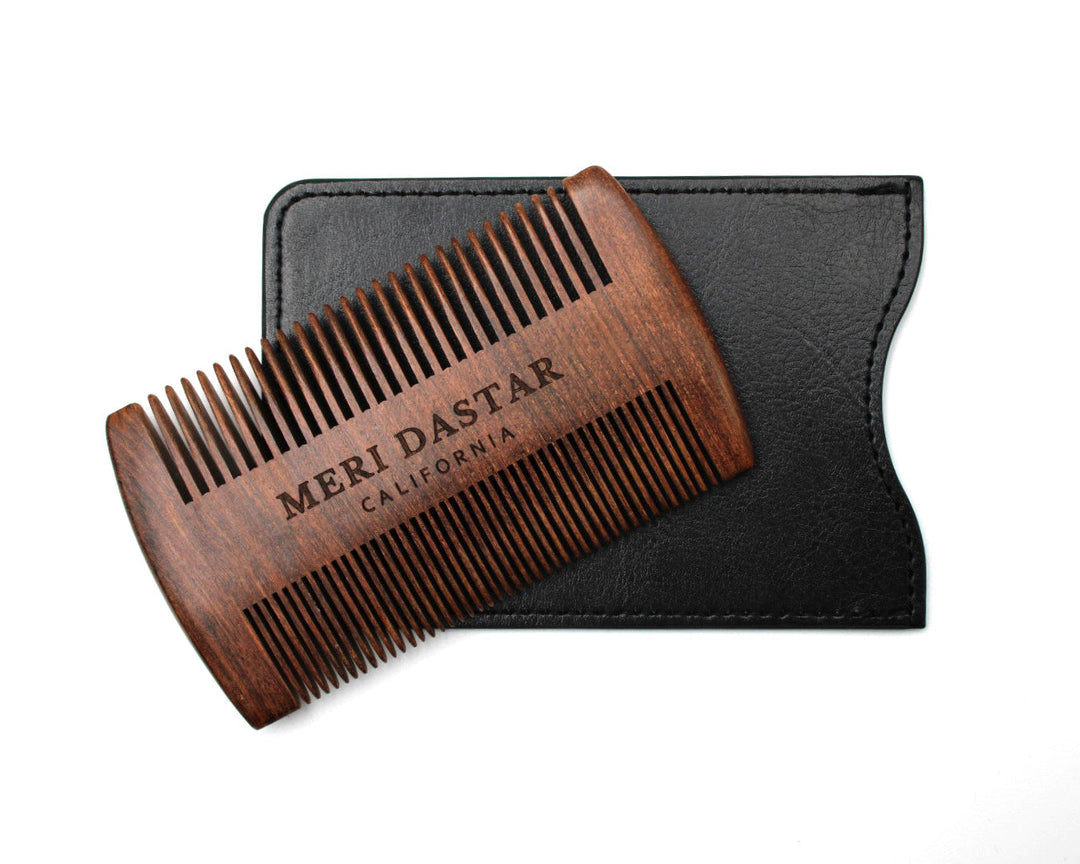 Wooden comb with black case on a white background, featuring 'MERI DASTAR' branding.
